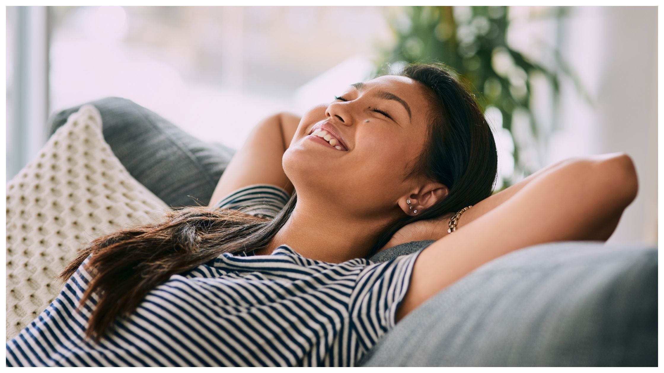 Young woman relaxing on the sofa at home